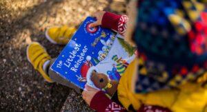 Little girl looking at book